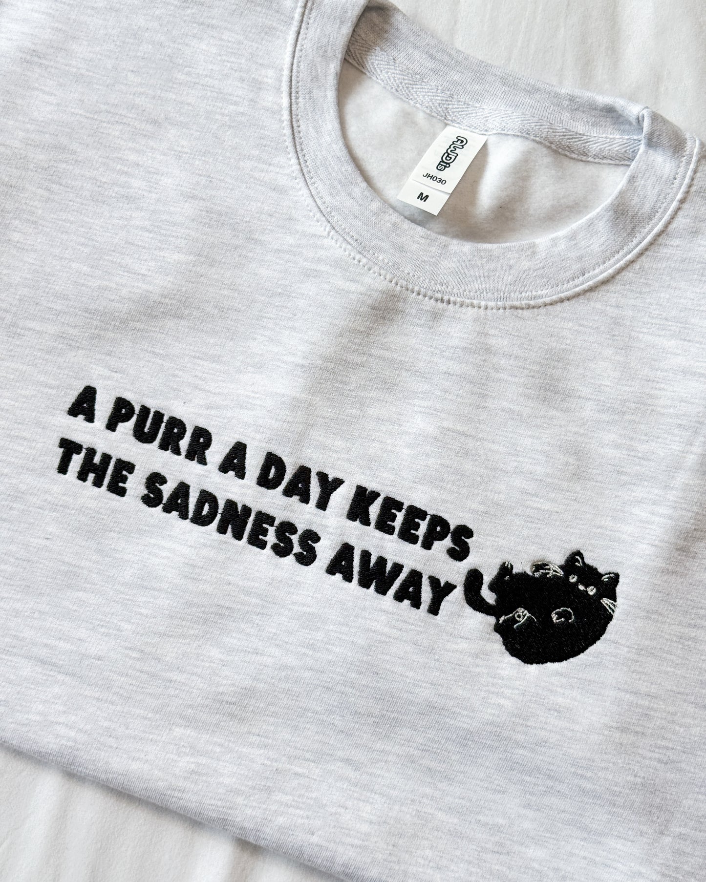 A PURR A DAY KEEPS THE SADNESS AWAY BLACK CAT EMBROIDERED SWEATSHIRT
