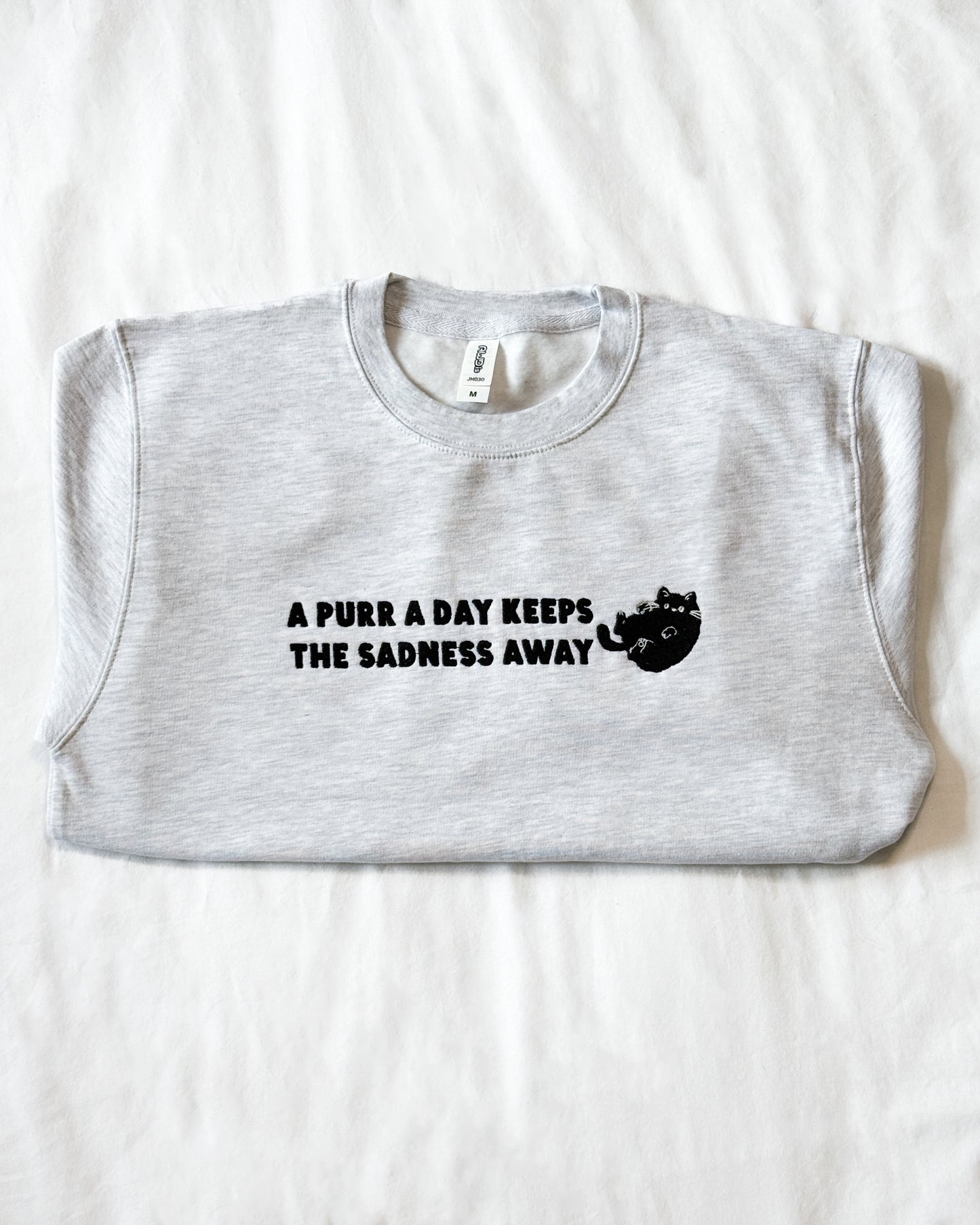 A PURR A DAY KEEPS THE SADNESS AWAY BLACK CAT EMBROIDERED SWEATSHIRT