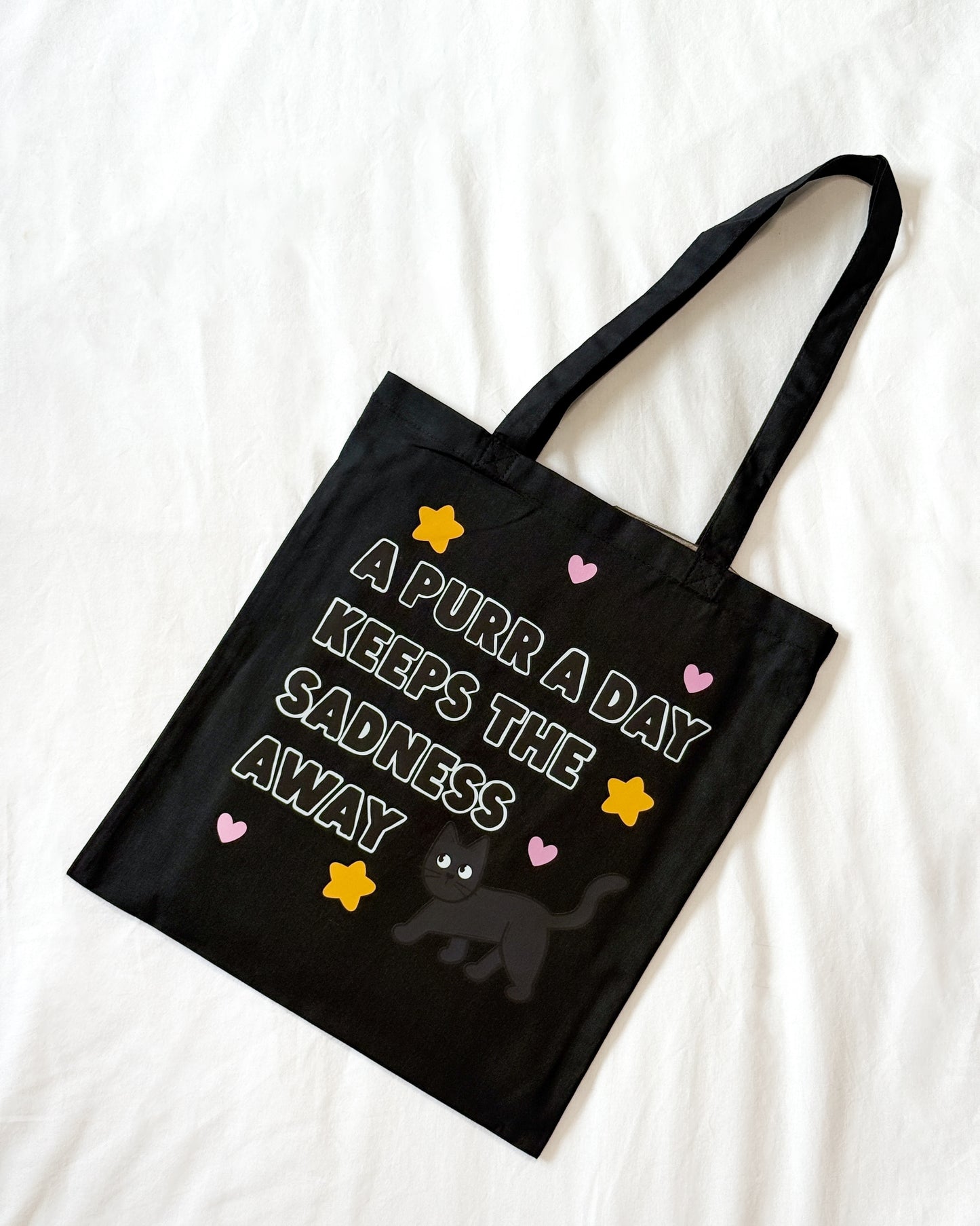 A PURR A DAY KEEPS THE SADNESS AWAY BLACK CAT TOTE BAG